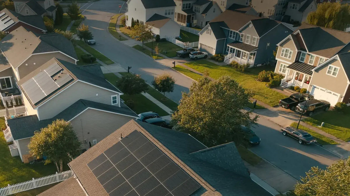 Aerial view of Illinois homes with rooftop solar panels in a residential neighborhood